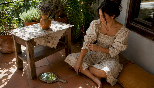 Woman wearing nap dress with smocked bodice indoors