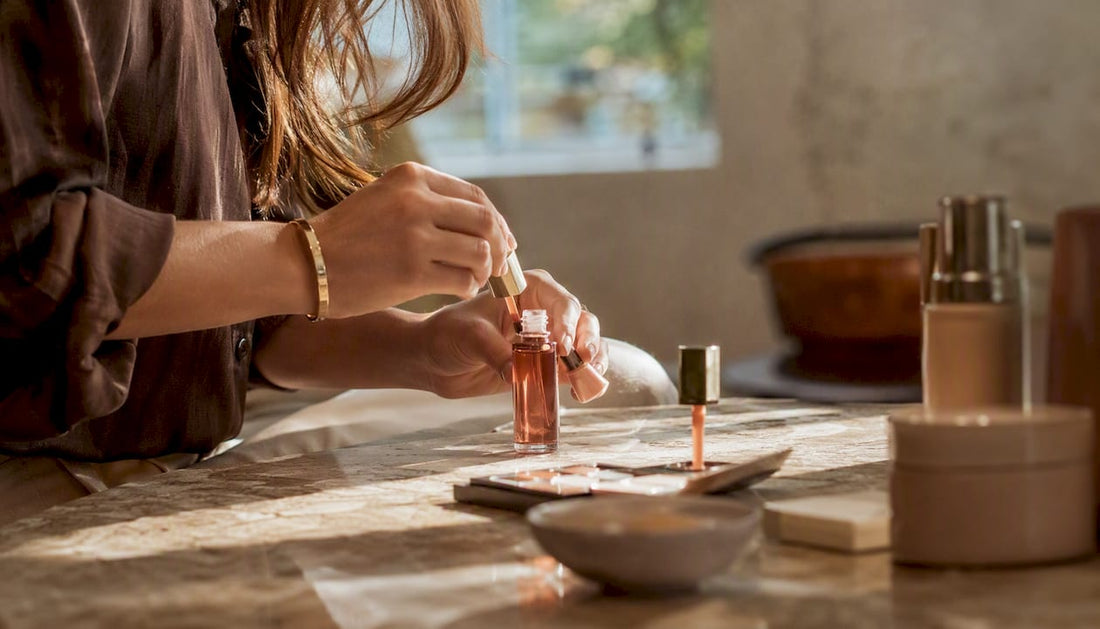 Hands arranging curated beauty product details