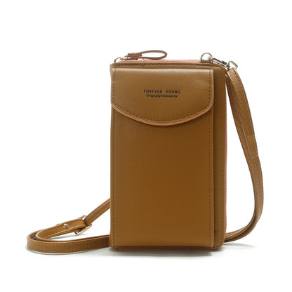 Tan leather crossbody phone bag with flap, FOREVER YOUNG text, minimalist design