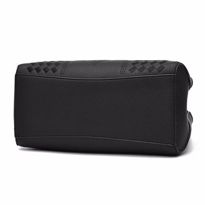 Black leather handbag bottom with textured pattern and elegant stitching detail