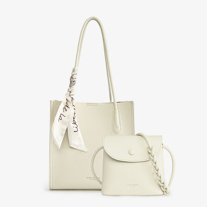 Beige tote bag with scarf accent and matching mini crossbody purse on white background