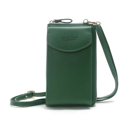 Green crossbody phone bag with strap and 'Forever Young' embossed on the flap